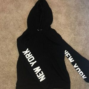 Forever 21 Black sweater. New york sleeves.